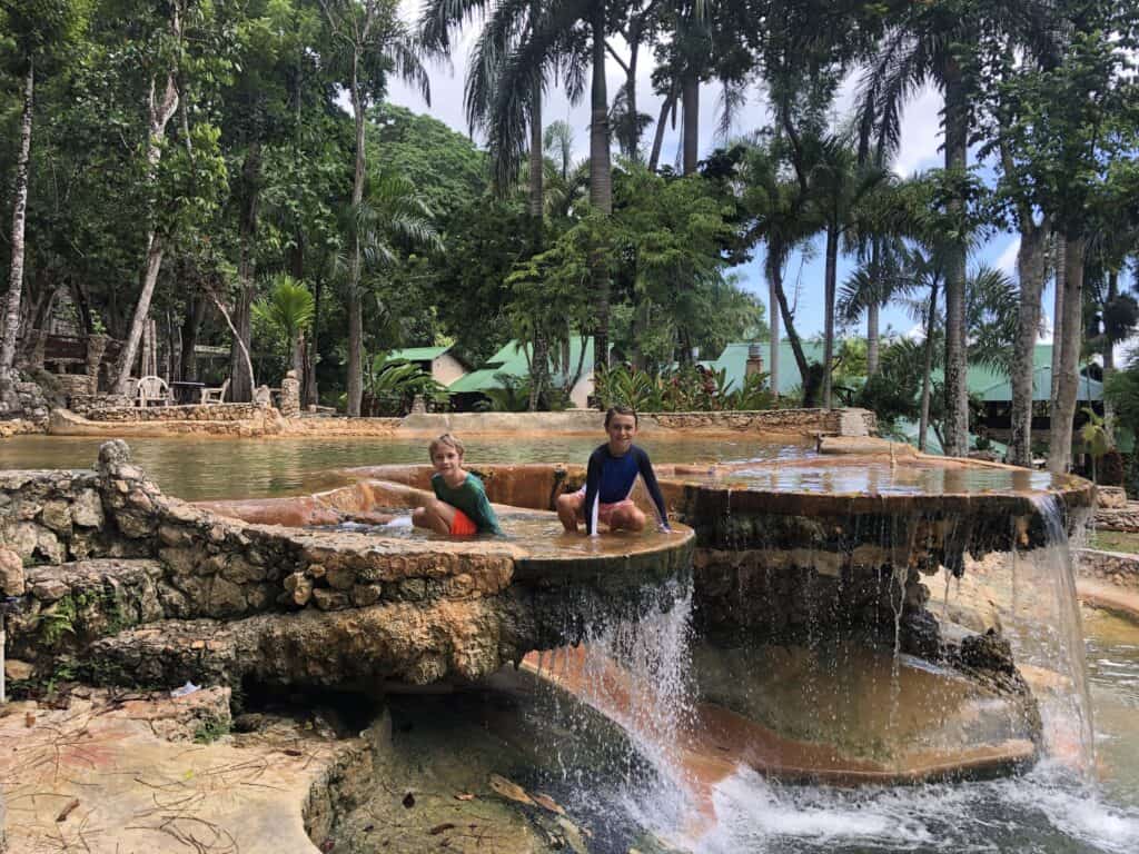 The boys swimming in the many pools at Cano Hondo eco lodge