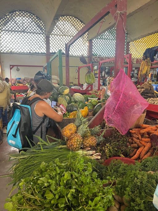 Debbie picking veggies at the market