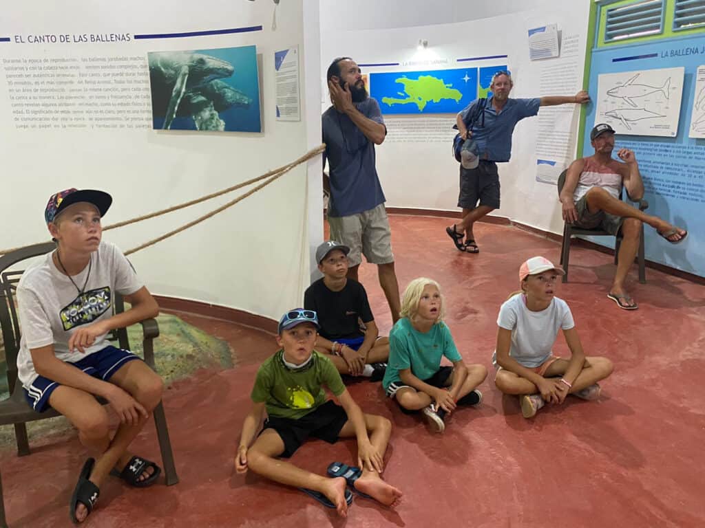 Boat kids watching a video at the whale museum in Samana