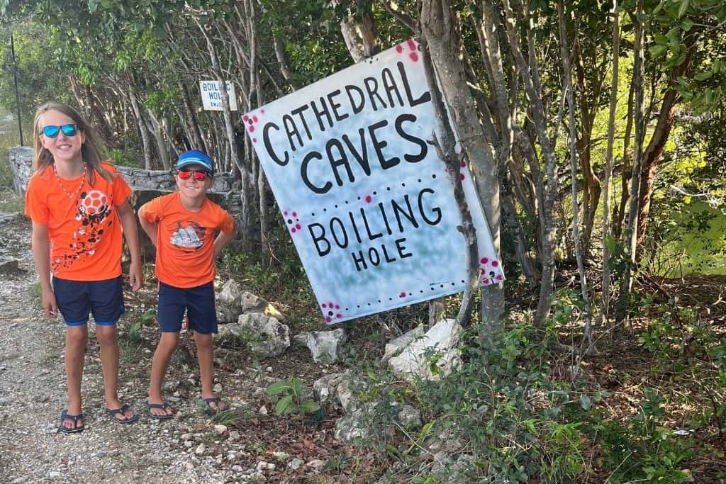 The boys with Cathedral Cave sign