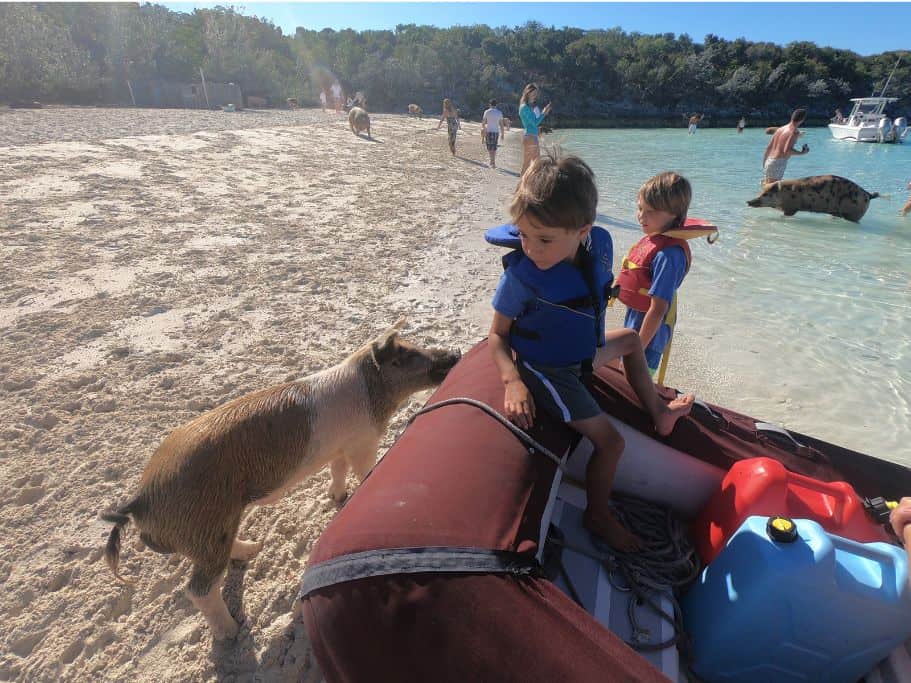 Boys arriving at Big Majors Pig Beach in the dinghy. 