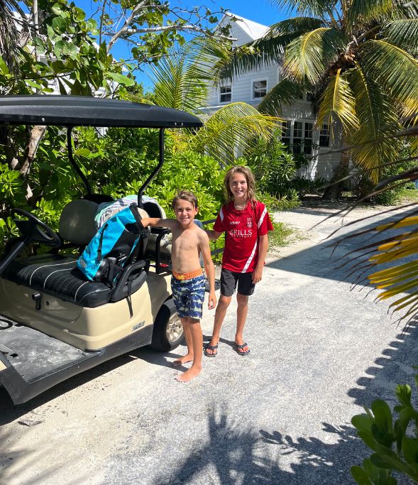 Boys by the golf cart in Spanish Wells